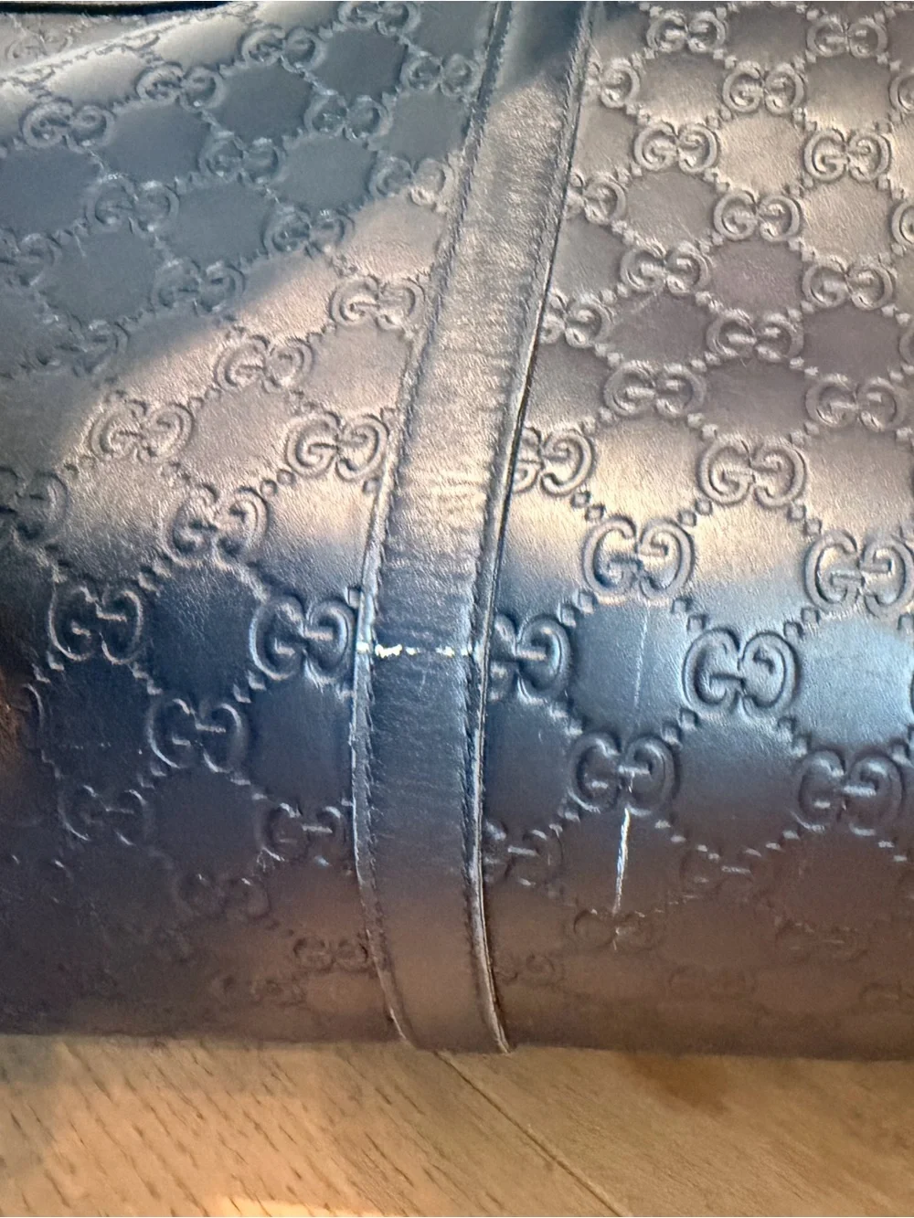 Gucci Navy Embossed GG Leather Duffel Bag